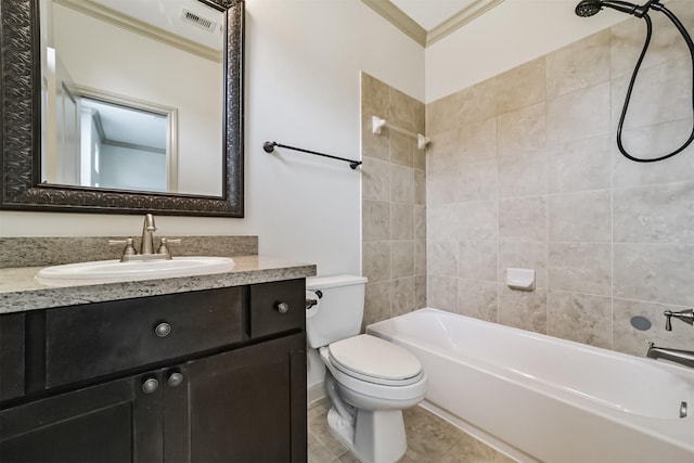 full bathroom featuring tile patterned flooring, toilet, vanity, tiled shower / bath combo, and crown molding