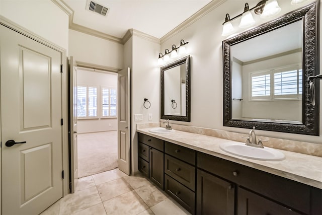 bathroom featuring vanity, tile patterned floors, and ornamental molding