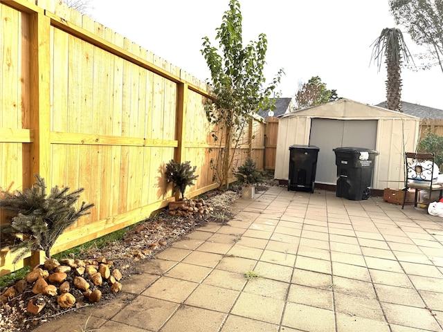 view of patio featuring a storage unit