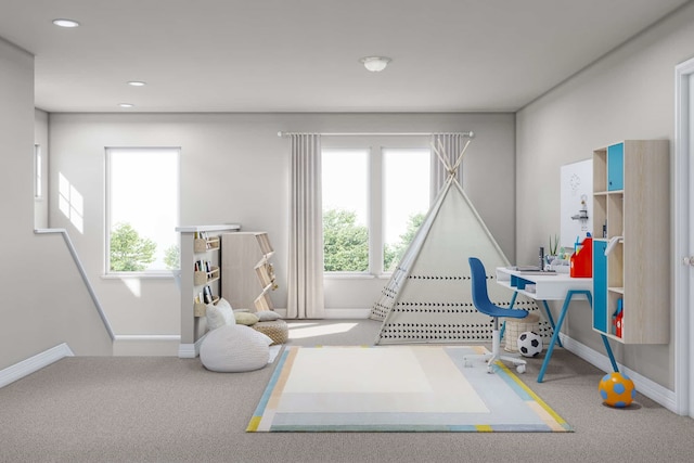 recreation room featuring a healthy amount of sunlight and carpet