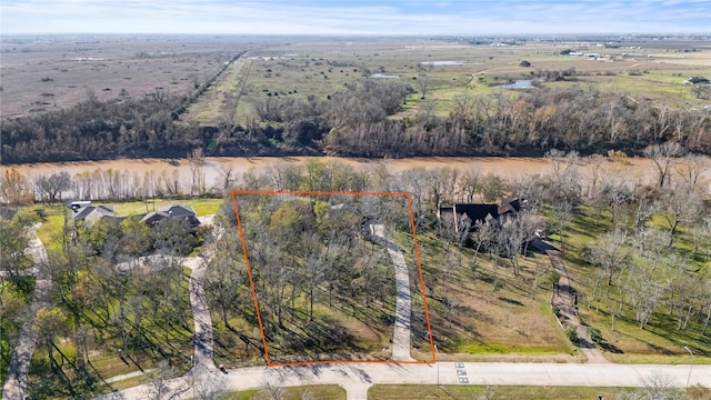 birds eye view of property with a rural view