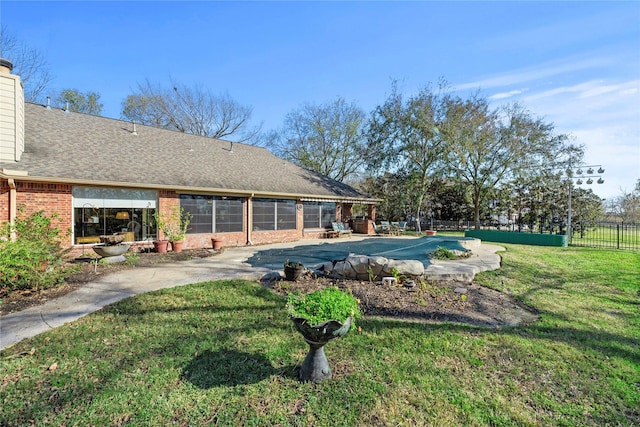 view of pool with a yard and a patio area