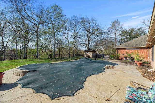 view of pool featuring a shed