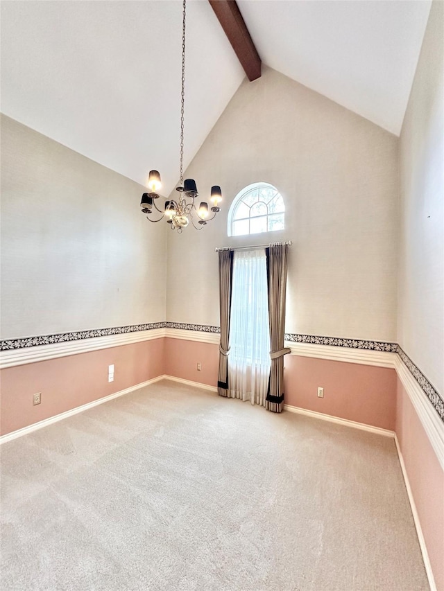 carpeted empty room featuring high vaulted ceiling, a notable chandelier, and beamed ceiling