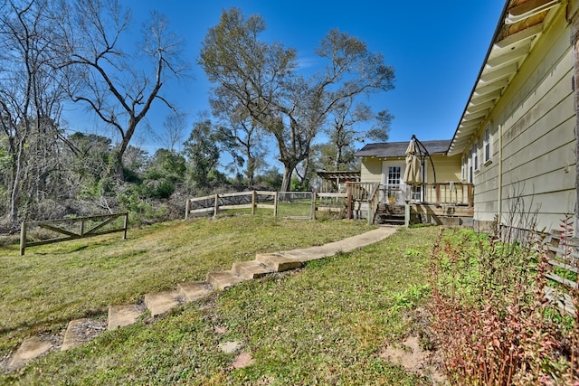 view of yard featuring a wooden deck