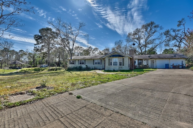 ranch-style home featuring a front yard and a garage