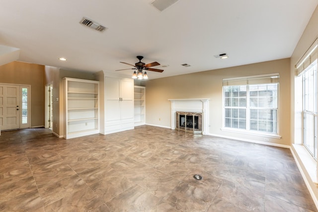 unfurnished living room with ceiling fan