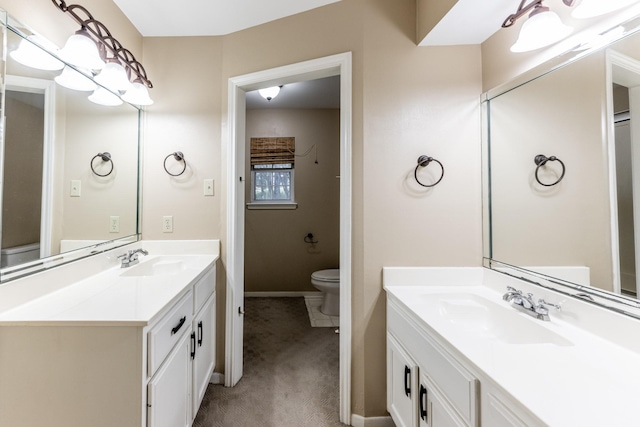 bathroom with toilet and vanity