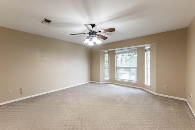 carpeted empty room with ceiling fan