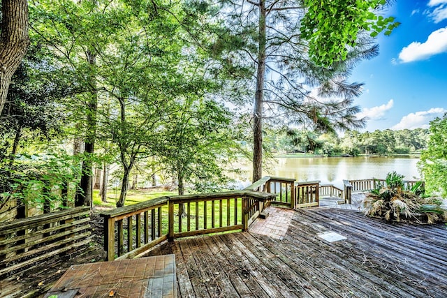 1915 E Lake Dr, Huntsville, TX 77340 - wooden terrace with a water view