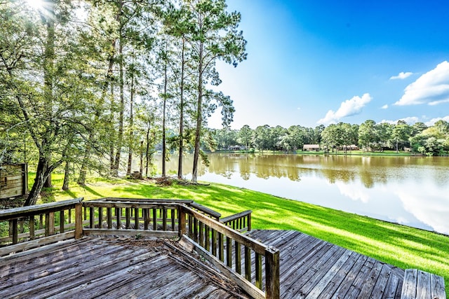 1915 E Lake Dr, Huntsville, TX 77340 - wooden deck featuring a water view and a lawn