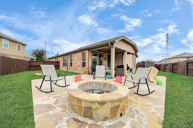 view of patio / terrace with an outdoor fire pit