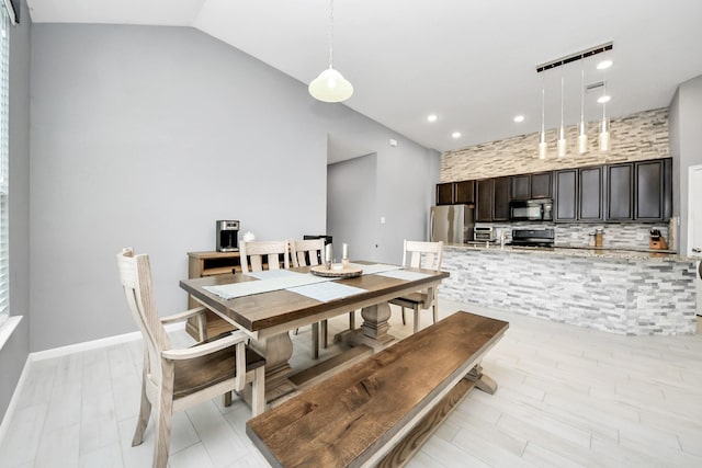 dining area with lofted ceiling