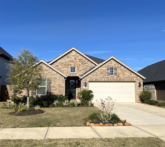 view of front of house with a front lawn and a garage