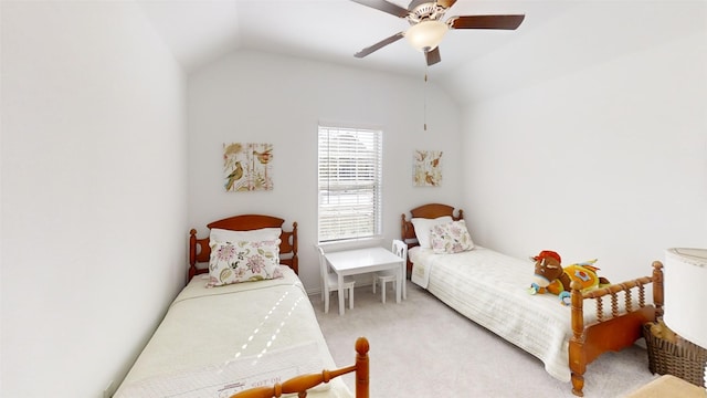 carpeted bedroom featuring ceiling fan and vaulted ceiling