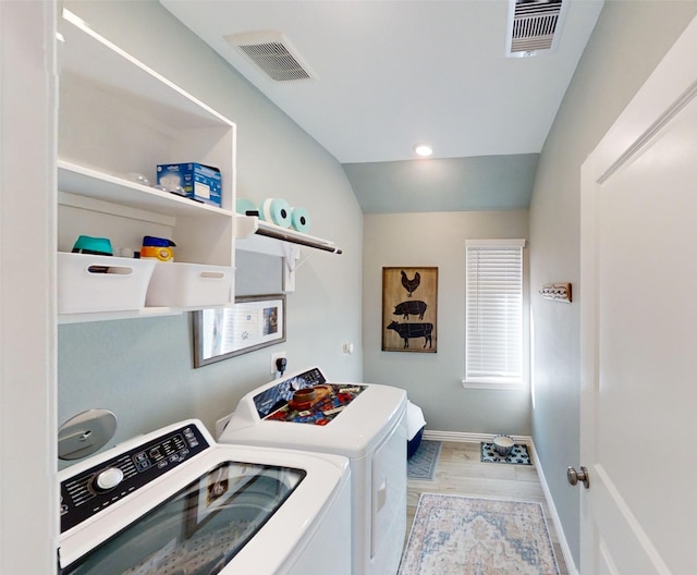 washroom featuring washing machine and clothes dryer