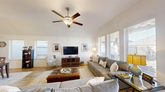 living room featuring ceiling fan, light hardwood / wood-style flooring, and plenty of natural light