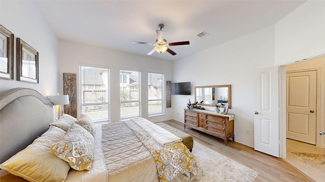 bedroom with ceiling fan and light hardwood / wood-style floors