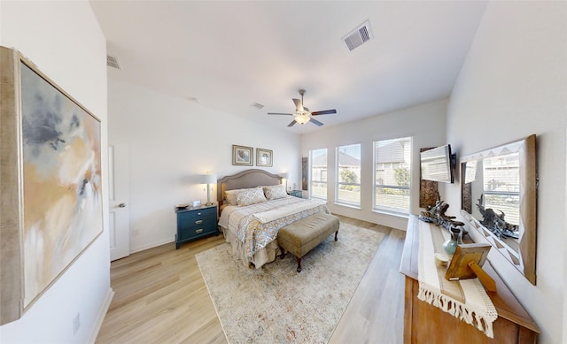 bedroom with ceiling fan and light hardwood / wood-style floors