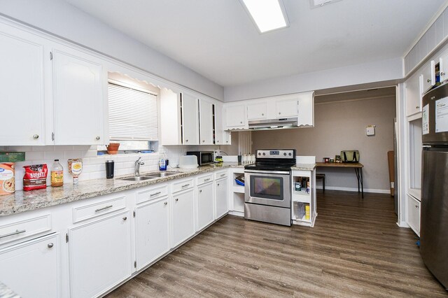 kitchen with appliances with stainless steel finishes, sink, and white cabinets