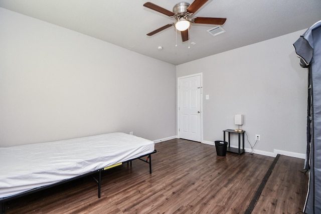 bedroom featuring dark wood-type flooring and ceiling fan