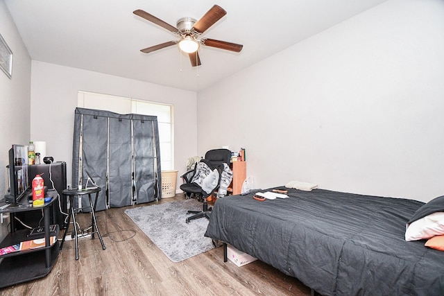 bedroom featuring ceiling fan and light hardwood / wood-style flooring