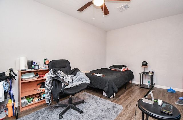 bedroom with hardwood / wood-style floors and ceiling fan