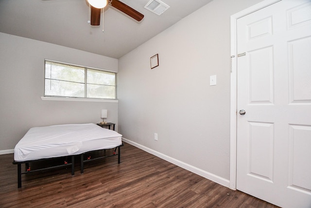 bedroom featuring ceiling fan, lofted ceiling, and dark hardwood / wood-style floors