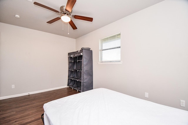 bedroom featuring ceiling fan and dark hardwood / wood-style floors