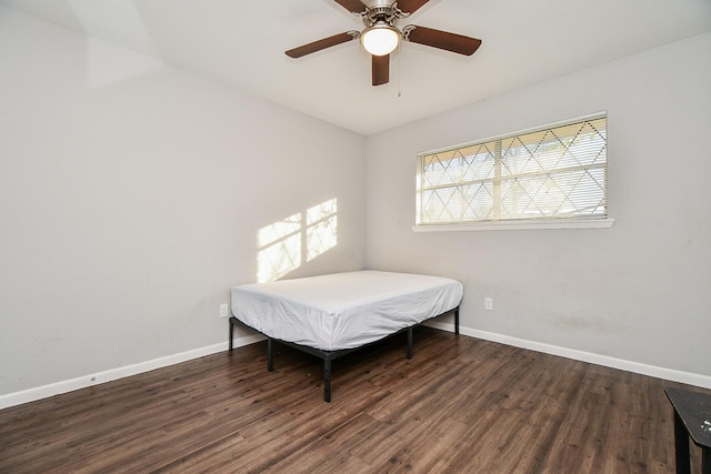 bedroom featuring dark hardwood / wood-style floors and ceiling fan