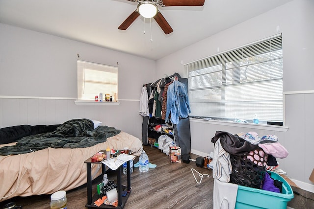 bedroom with ceiling fan and hardwood / wood-style floors