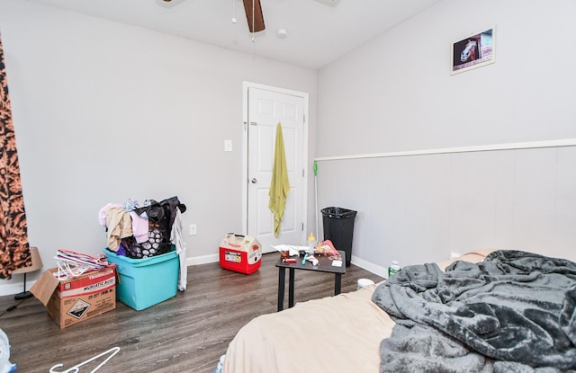 bedroom with dark wood-type flooring and ceiling fan