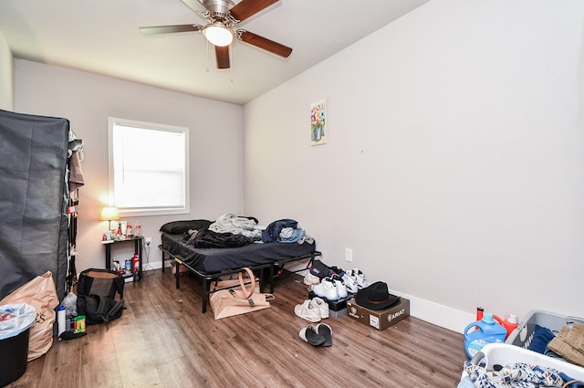 bedroom featuring wood-type flooring and ceiling fan