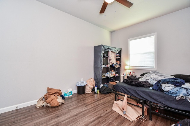 bedroom featuring hardwood / wood-style floors and ceiling fan