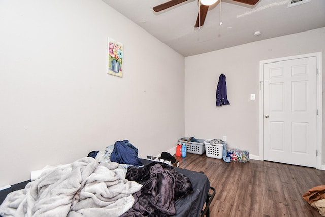 bedroom with dark wood-type flooring and ceiling fan