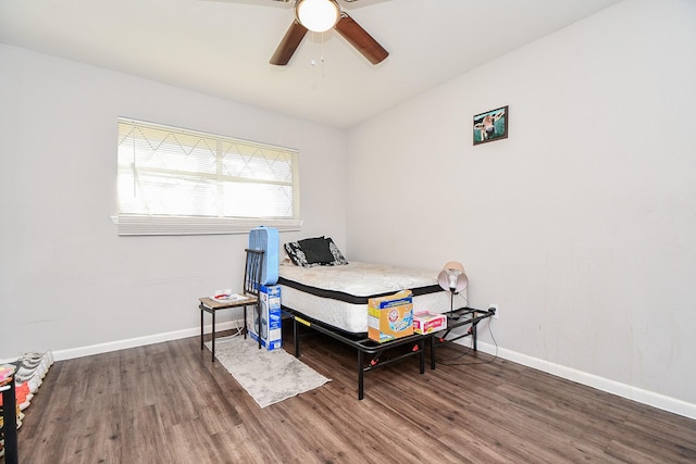 bedroom featuring dark hardwood / wood-style floors and ceiling fan