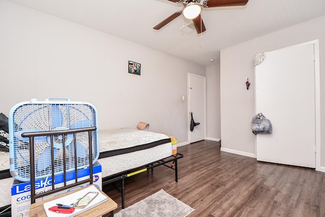 bedroom with wood-type flooring and ceiling fan