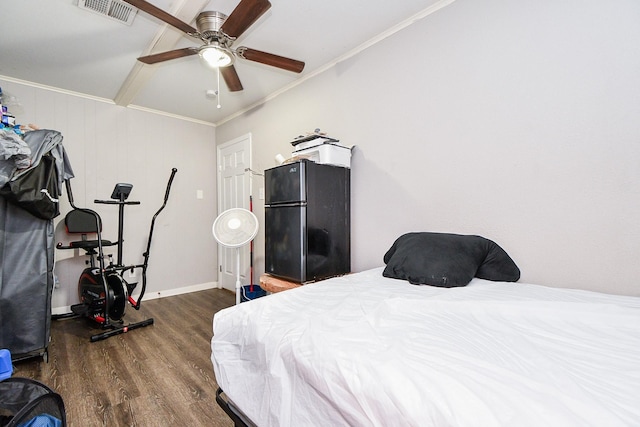 bedroom with black refrigerator, crown molding, dark hardwood / wood-style flooring, and ceiling fan