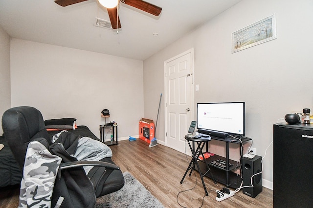 interior space featuring ceiling fan and wood-type flooring