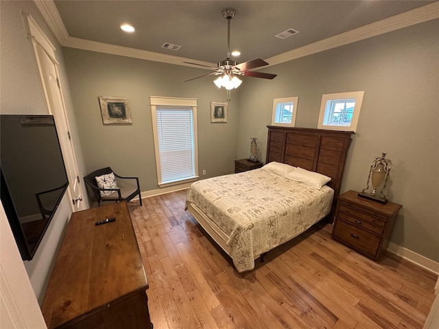 bedroom featuring crown molding, ceiling fan, and light hardwood / wood-style flooring