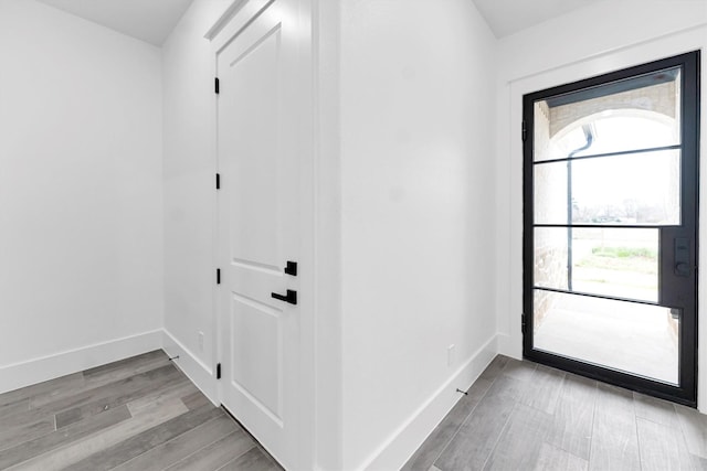 foyer entrance with light wood-type flooring