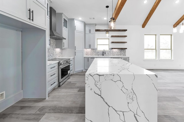 kitchen with stainless steel electric range, light stone countertops, pendant lighting, beam ceiling, and wall chimney range hood