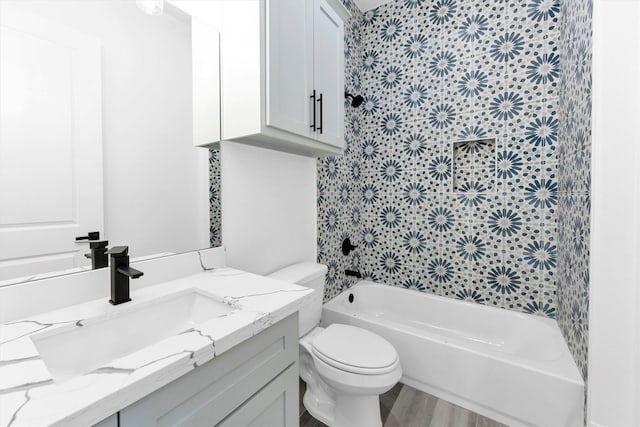 full bathroom featuring toilet, vanity, shower / bathing tub combination, and hardwood / wood-style flooring