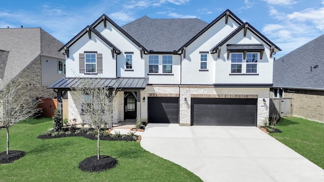 modern farmhouse style home with stucco siding, driveway, a standing seam roof, stone siding, and a garage