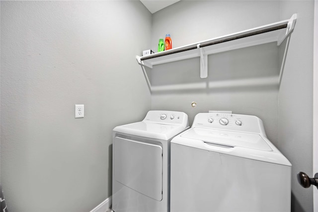 washroom with washing machine and dryer