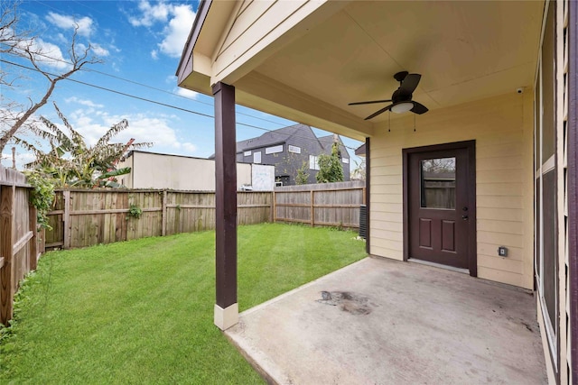 view of yard with a patio area and ceiling fan