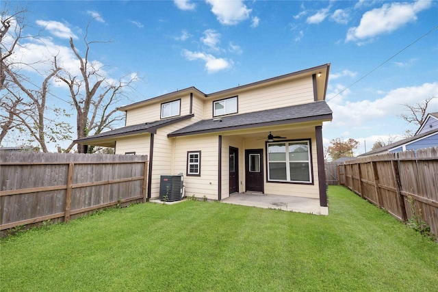 rear view of house with a patio, ceiling fan, central AC, and a lawn