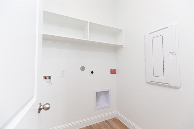 laundry room featuring gas dryer hookup, light hardwood / wood-style floors, electric dryer hookup, and hookup for a washing machine