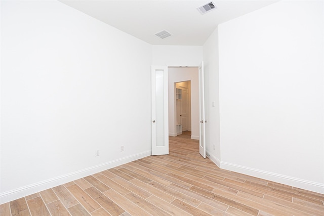 unfurnished room featuring light wood-type flooring