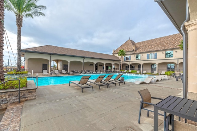 view of swimming pool with a patio area